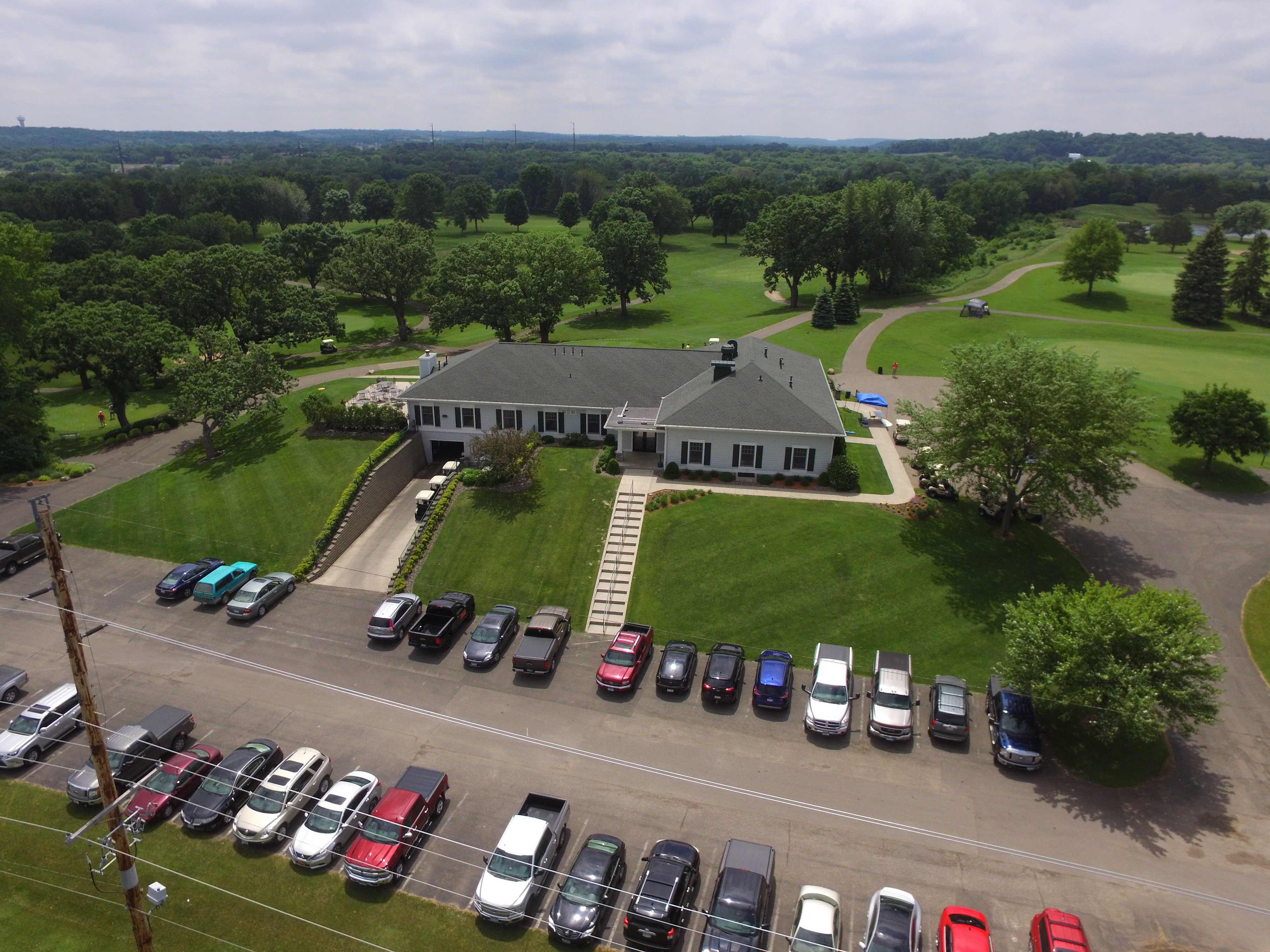 view of golf course with parking lot